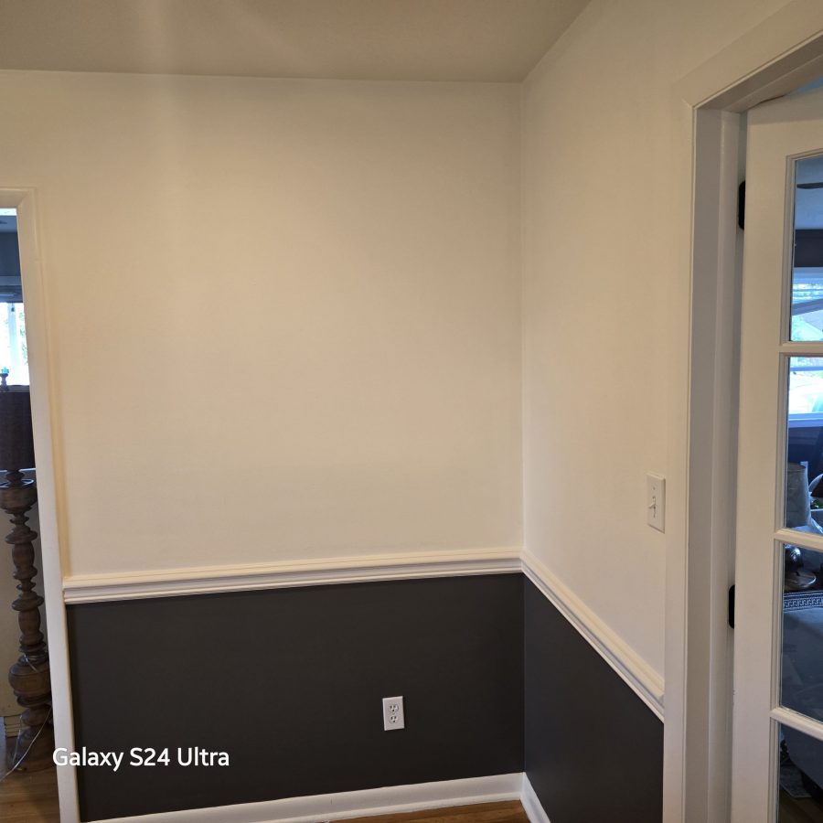 home hallway with walls painted dark and white, separated with trim Preview Image 2