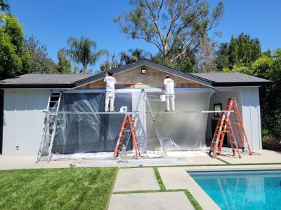 Staining and painting a pool house in Encino, California.