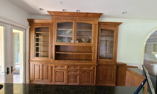 A Bar with built-in shelving and cabinets