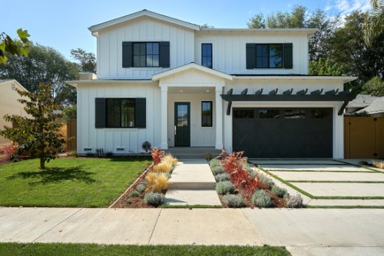 A farm style house in Beverly Hills, California after being painted white.