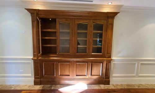 A built-in display case with Cabinets