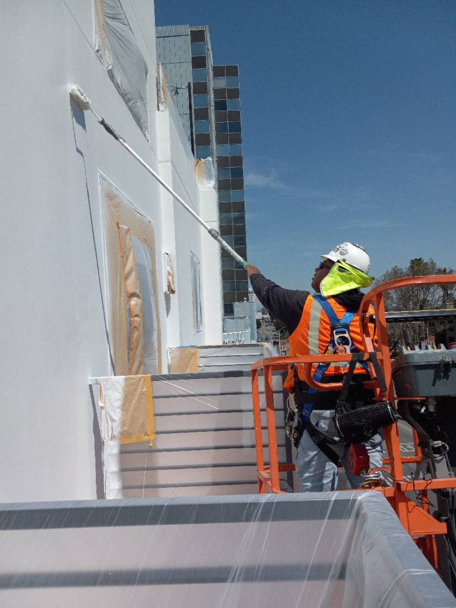 Painter on boom crane at work Preview Image 4