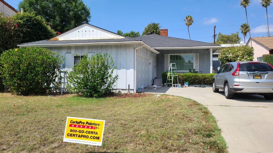 Faded gray home before being repainted a bright blue. Preview Image 1