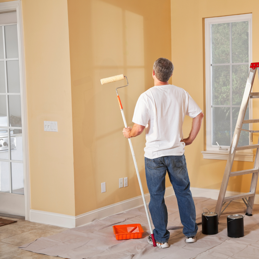 Homeowner in South Arlington DIY painting a room yellow