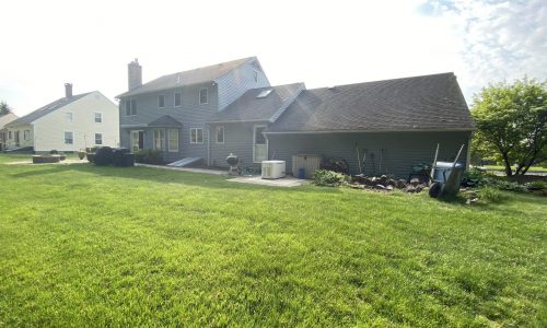 A view of the back of the house before painting.