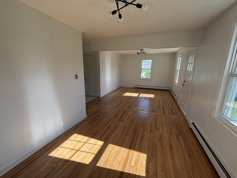 interior room in house with wooden floors and dirty and worn paint on walls Preview Image 12
