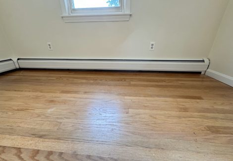painted interior room in house with wooden floors