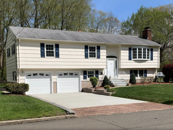 Exterior house painting on a raised ranch in Rocky Hill, CT.