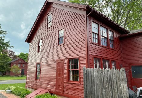 This is a side view of the antique home in Old Wethersfield after being painted.