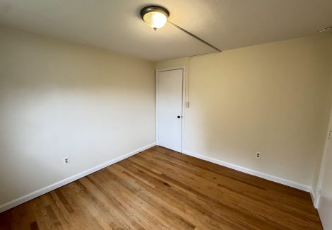 painted interior room in house with wooden floors