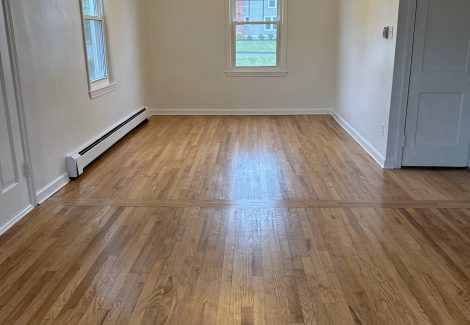 painted interior room in house with wooden floors