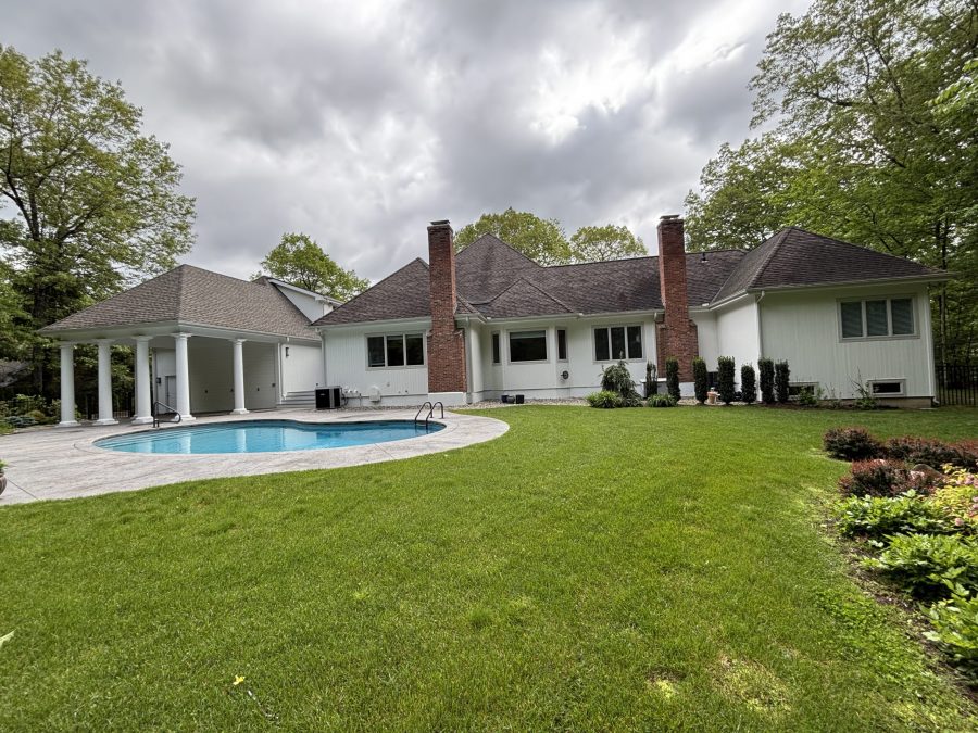 rear view of house with yard and pool Preview Image 6