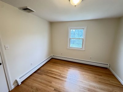 painted interior room in house with wooden floors