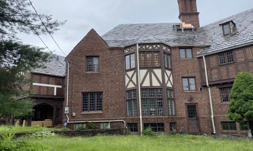 The white downspouts detract from the look