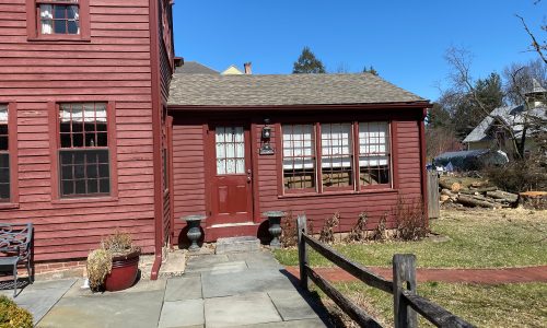 The fading is apparent on the main house and addition.