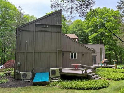 painted house exterior with matching gutters