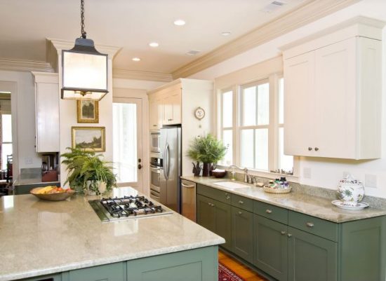 Kitchen with white cabinets and green accent colors