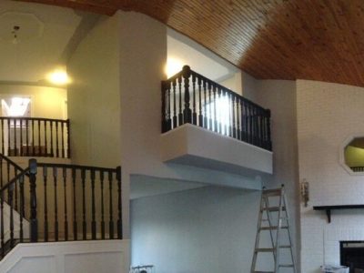 Interior banister painting by CertaPro Painters in Southern Alberta
