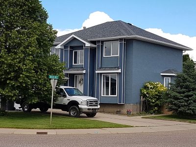 Exterior stucco house painting by CertaPro house painters in Medicine Hat, AB