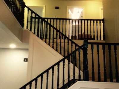 Interior banister painting by CertaPro house painters in Southern Alberta