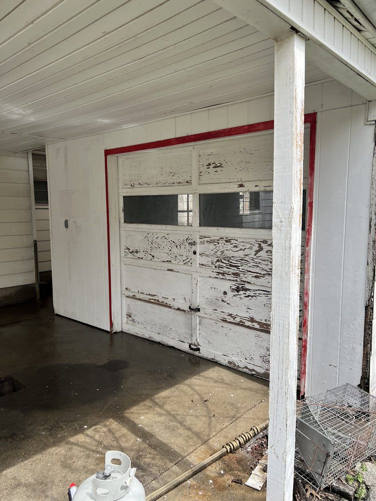 before photo of garage door and exterior walls Preview Image 3