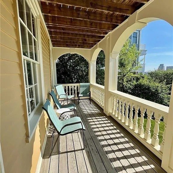 yellow painted historical home exterior and front porch Preview Image 3