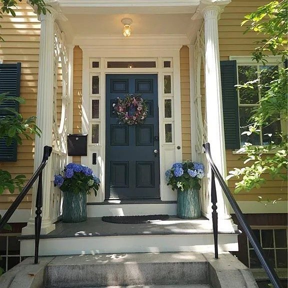 yellow painted historical home exterior Preview Image 1