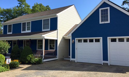 Exterior Blue Home and Garage