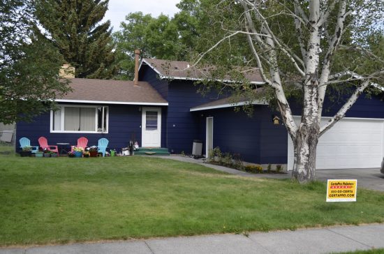 after photo of navy colored repainted house