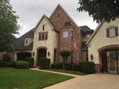 colleyville three-story home stone and brick