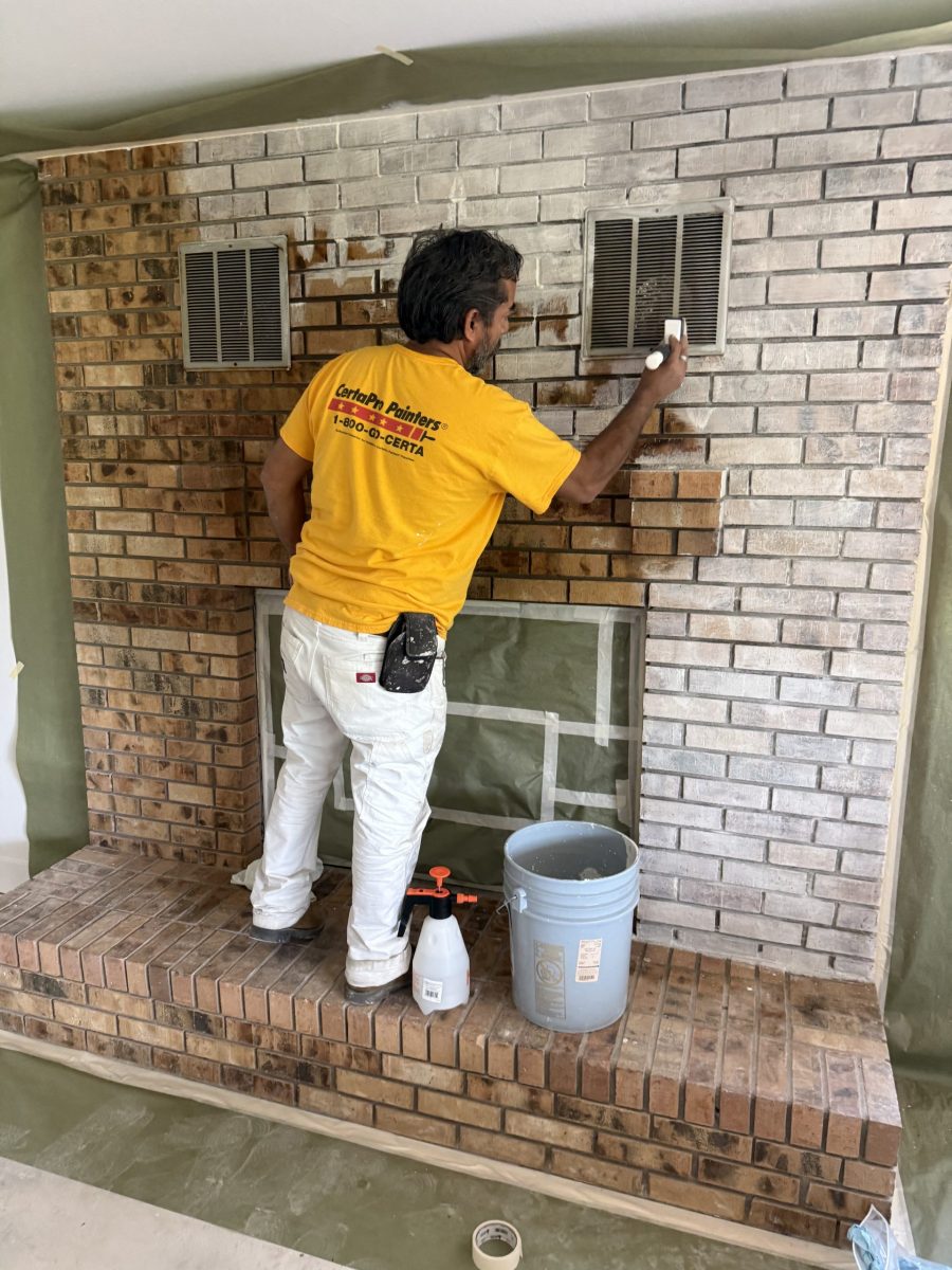 painter during fireplace limewash