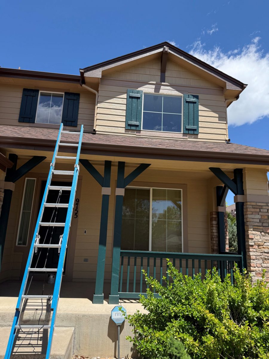ladder leaning against roof of home Preview Image 1
