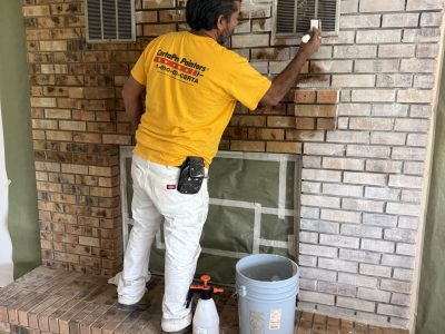 painter during fireplace limewash