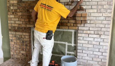 painter during fireplace limewash