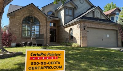 certapro sign in front yard of stone and siding home