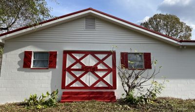 Exterior Painting of White Barn with Red Accents