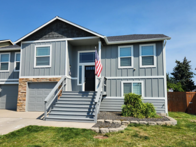 Two story house painting in North Spokane