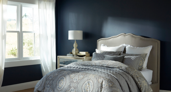 bedroom with dark blue wall paint