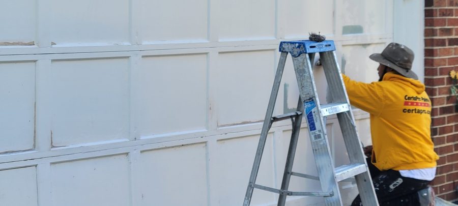 certpro painter working on garage door Preview Image 5