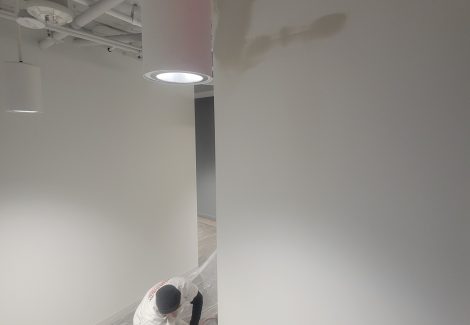 painter working on drywall