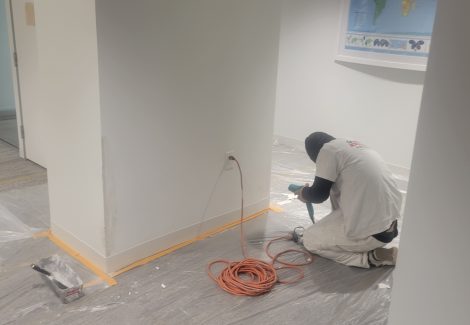 painter working on drywall