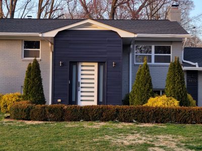 blue wood siding and grey brick home in alexandria, virginia