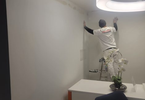 painter working on drywall