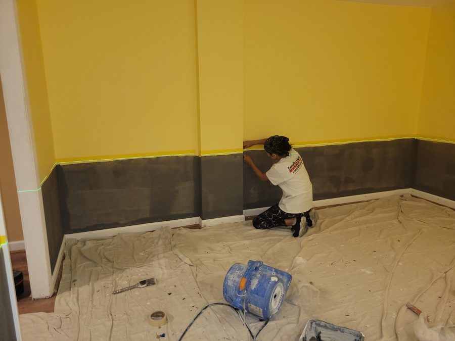 woman painting home interior wall with grey and yellow Preview Image 9