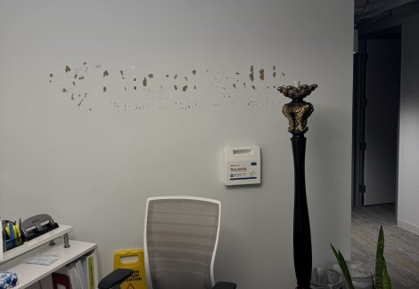 commercial space with damaged drywall