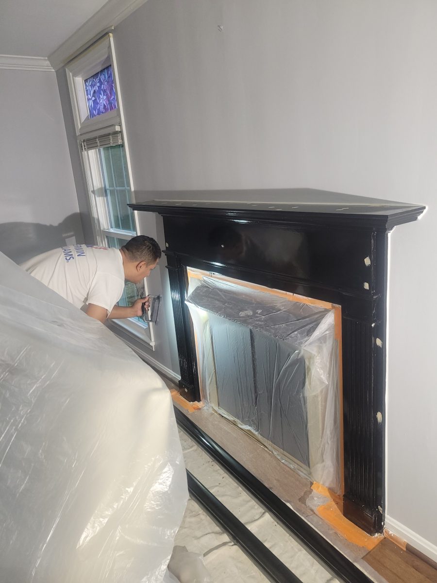 man painting fireplace mantle Preview Image 6