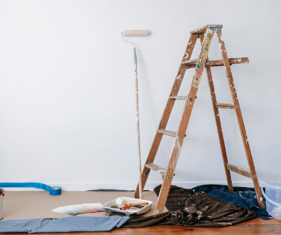 ladder and painting supplies in room