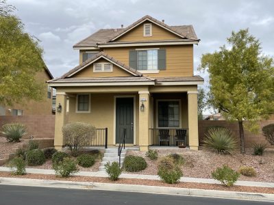Beige stucco and siding home in summerlin, nv