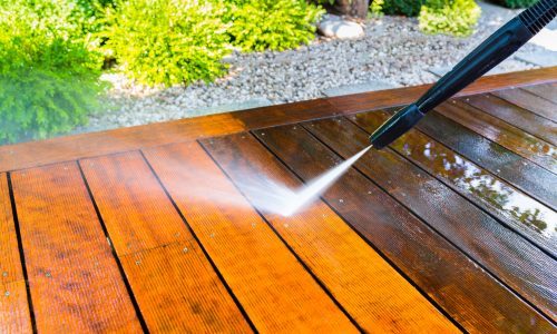 Pressure washing wood deck surface