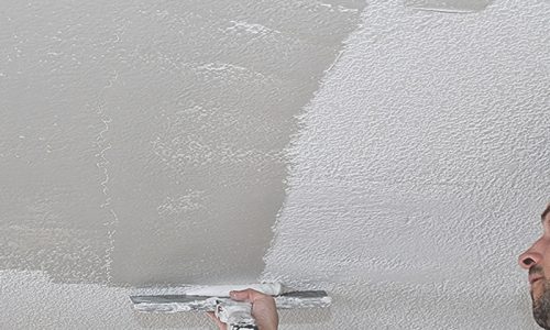 Popcorn ceiling removal services man manually skim coat